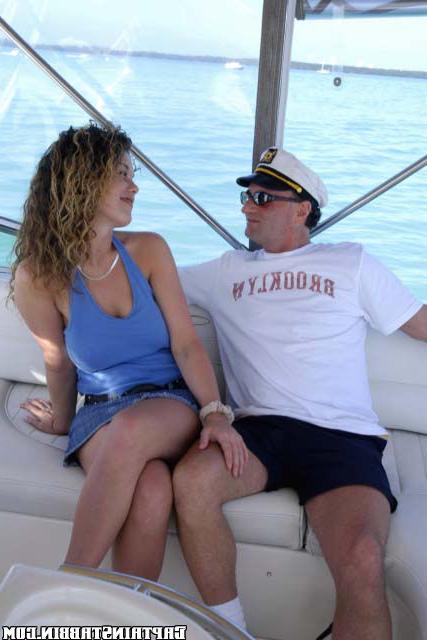 Curly slut agreed to have sex with two strangers on yacht 6 photo