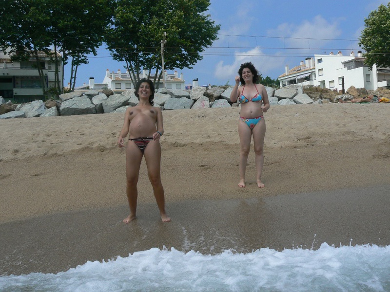 Pregnant with girlfriend relaxing topless on the beach 11 photo