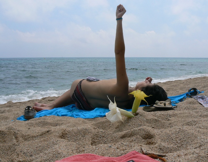 Pregnant with girlfriend relaxing topless on the beach 4 photo