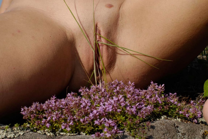 Mature babe with tender pink pussy posing on a rocky cliff 12 photo