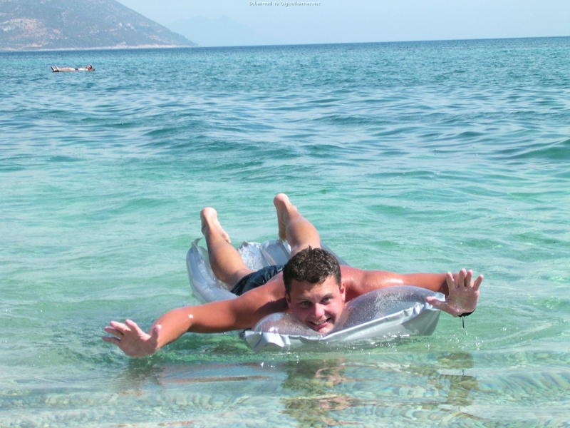 Couple without complexes rest on a wild beach 4 photo