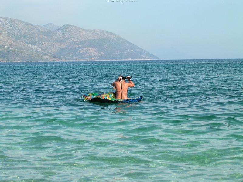 Couple without complexes rest on a wild beach 6 photo