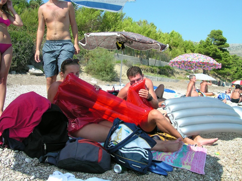 Couple without complexes rest on a wild beach 5 photo